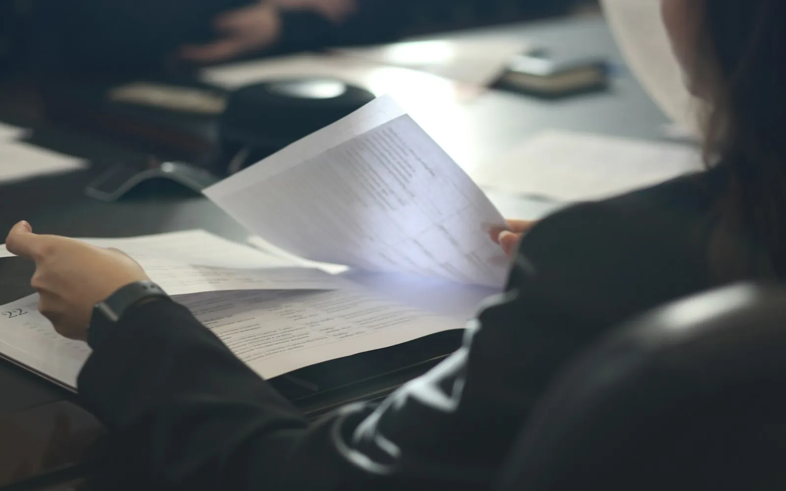 Homeowner reviewing insurance paperwork at a kitchen table