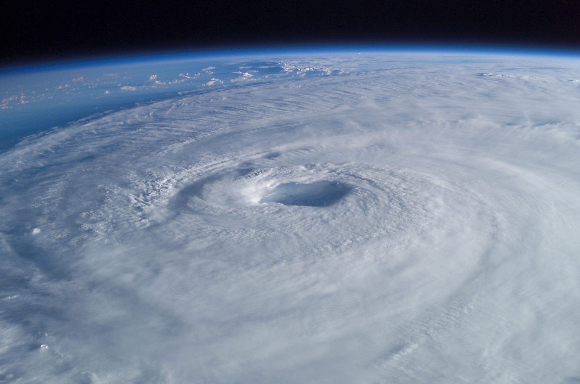 Satellite view of a hurricane spiral and eye over the ocean