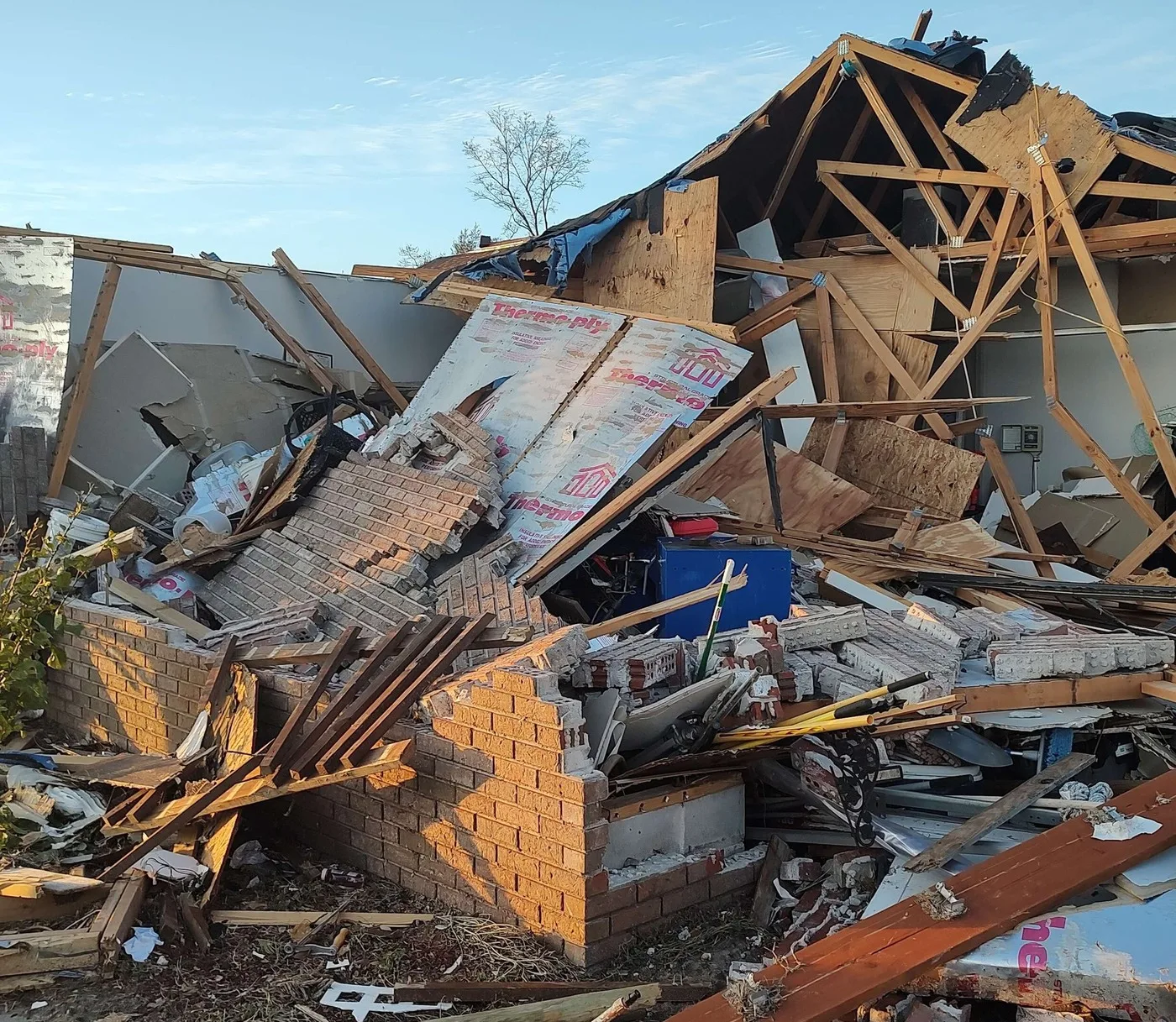 Storm-damaged home illustrating losses we document for Erie claims