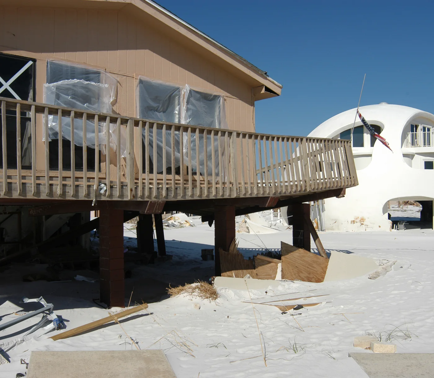 Illustrative Florida coastal homes with storm-surge damage, including a distinctive dome house — FEMA Photo Library; not a client file