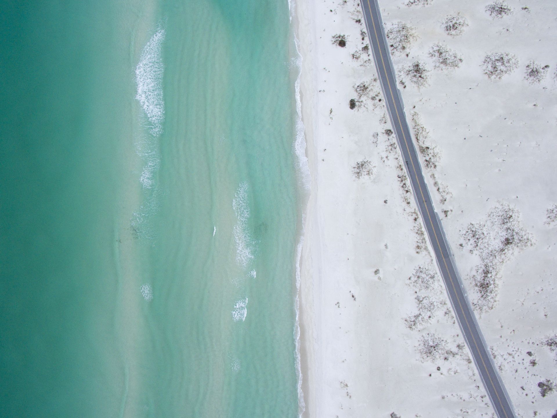 Aerial view of the beach road and Gulf shoreline on Santa Rosa Island near Pensacola Beach, Florida