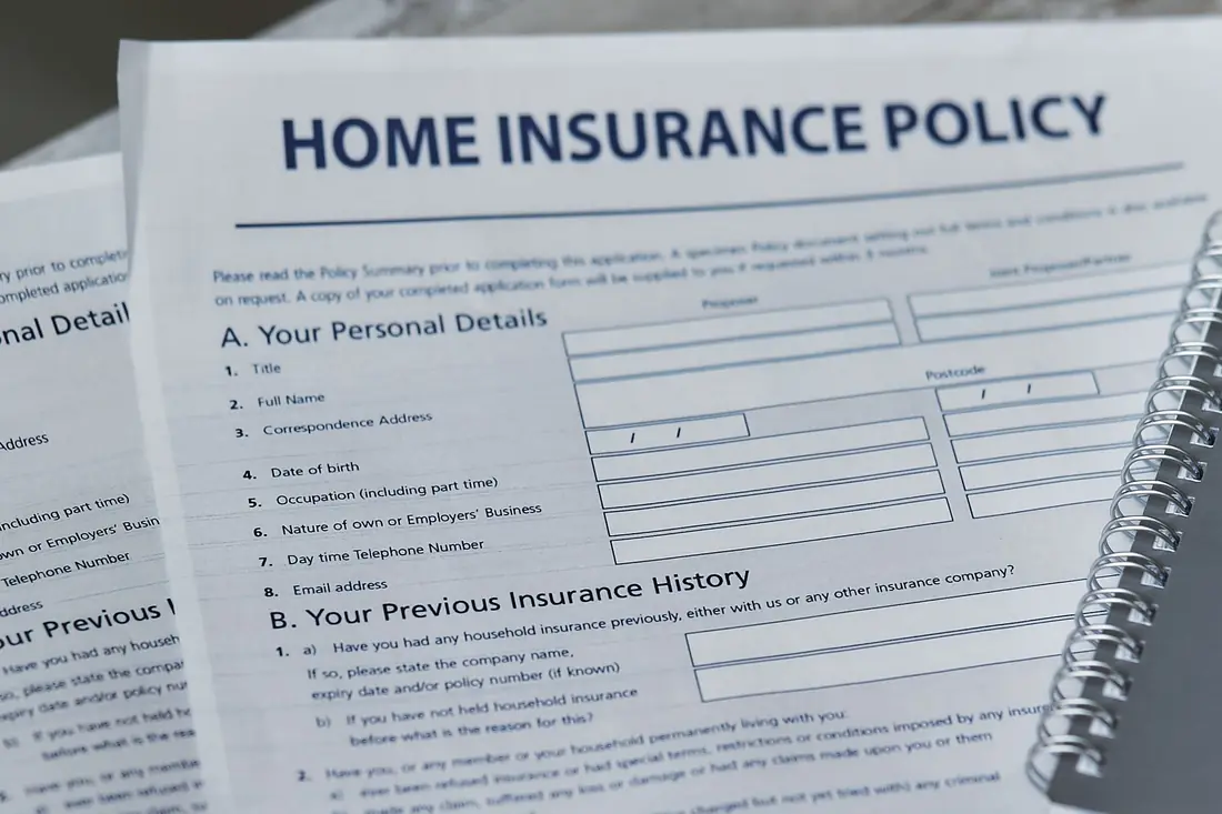 Home insurance policy form on a desk